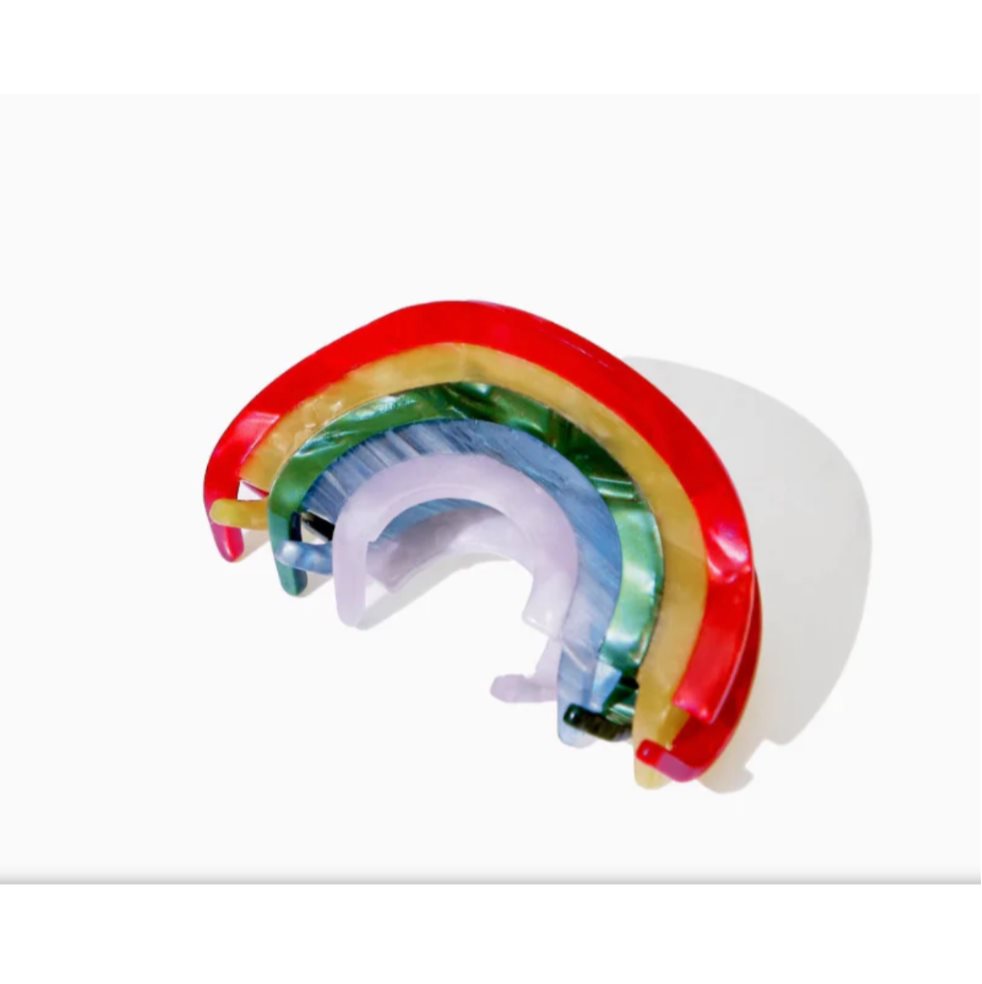 Gancho Arcoíris Pinza para Cabello Perlado NEON X 1 Und NEON 1 und x 1 Clip perlado con diseño de arcoíris, ideal para darle un toque delicado y moderno a cualquier peinado. Marca NEON.